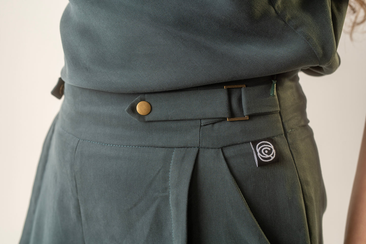 Teal pleat trousers